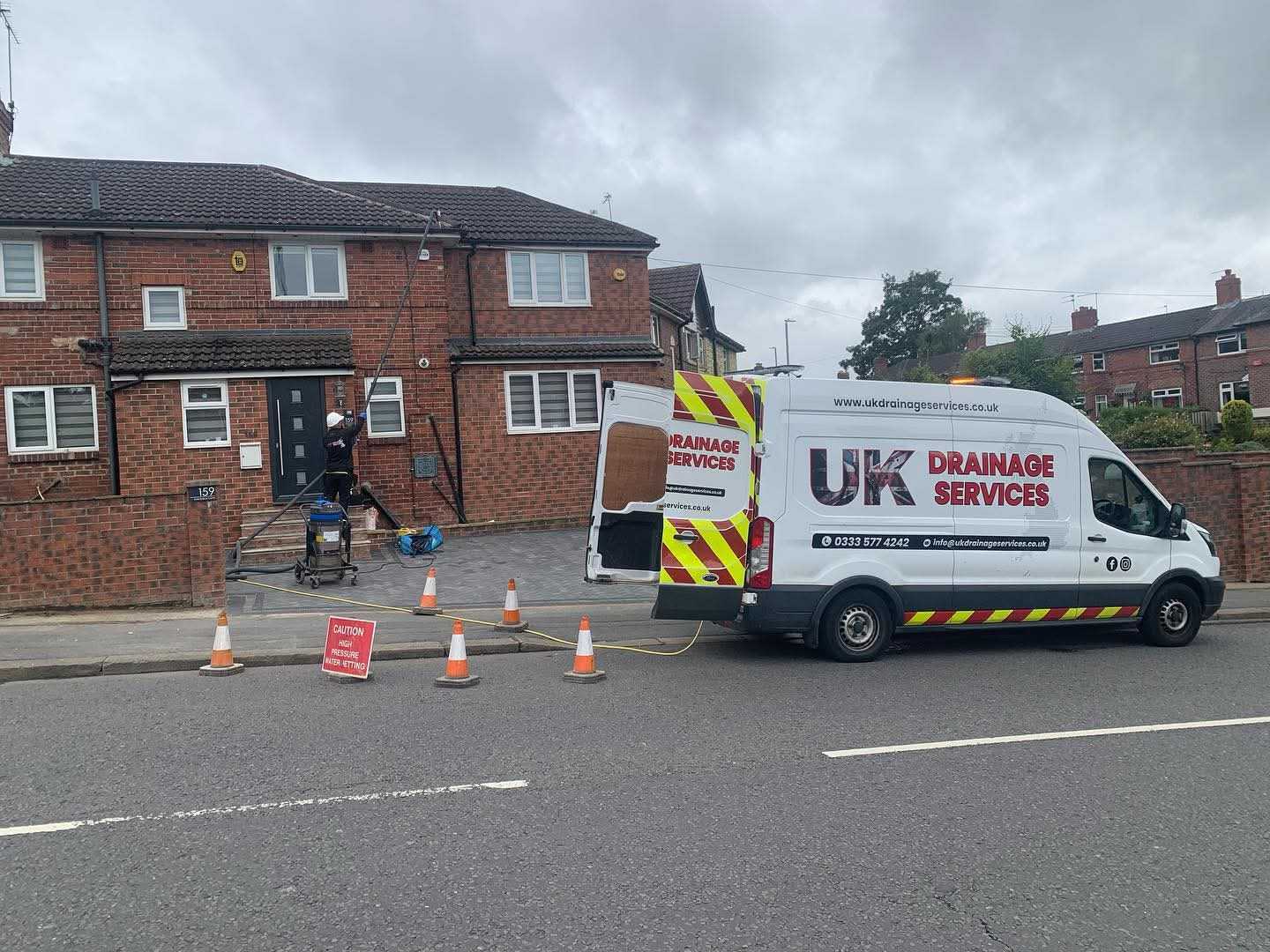 UK Drainage Services engineer at a residential property