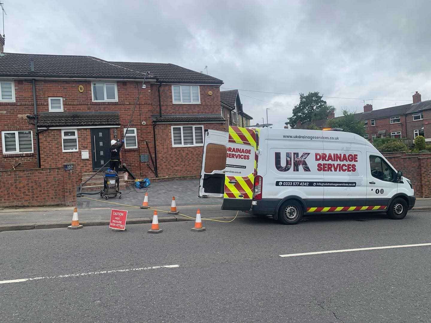 UK Drainage Services engineer at a residential property